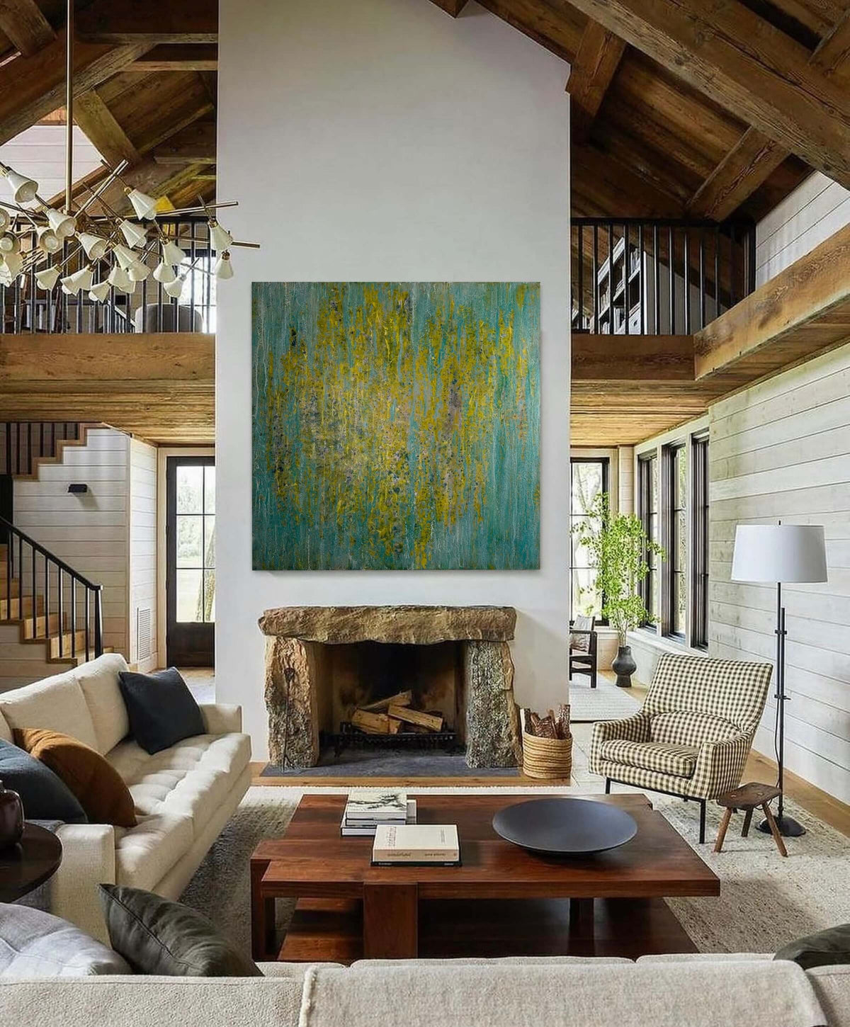 Original abstract encaustic painting in greens, yellows and blues with vertical textured layers displayed above a fireplace in a modern farmhouse interior