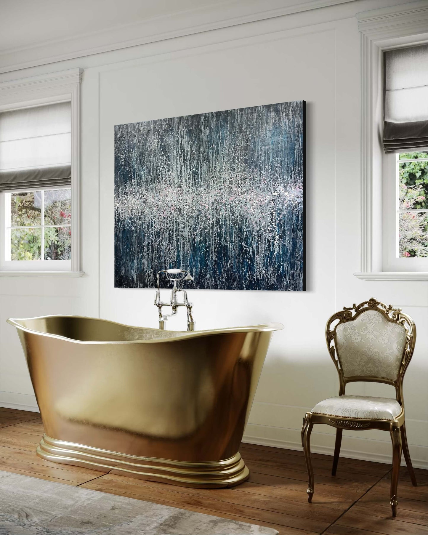 Original abstract encaustic painting in dark, moody blues with many intricate and lace like lines traveling towards the centre of the painting. Down/across the middle of this piece are a cluster of many drips and splatters of wax in pinks, white and light blue colours. Displayed above a gold free standing bathtub in a traditional bathroom interior