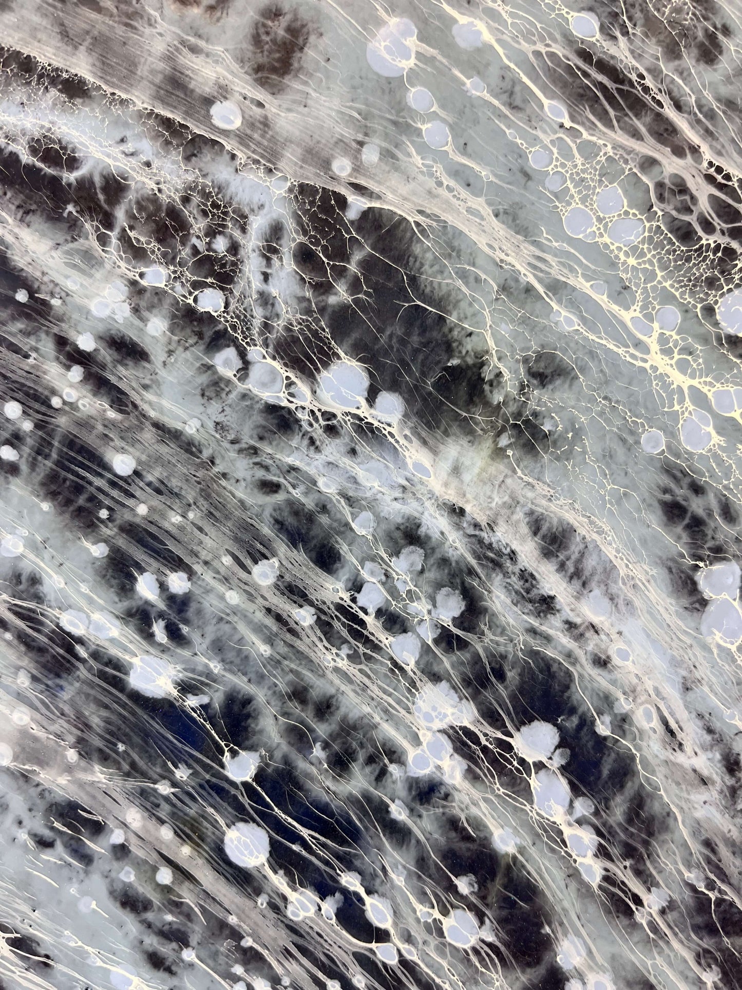Close-up of a marble-like surface with gray, black, and white patterns