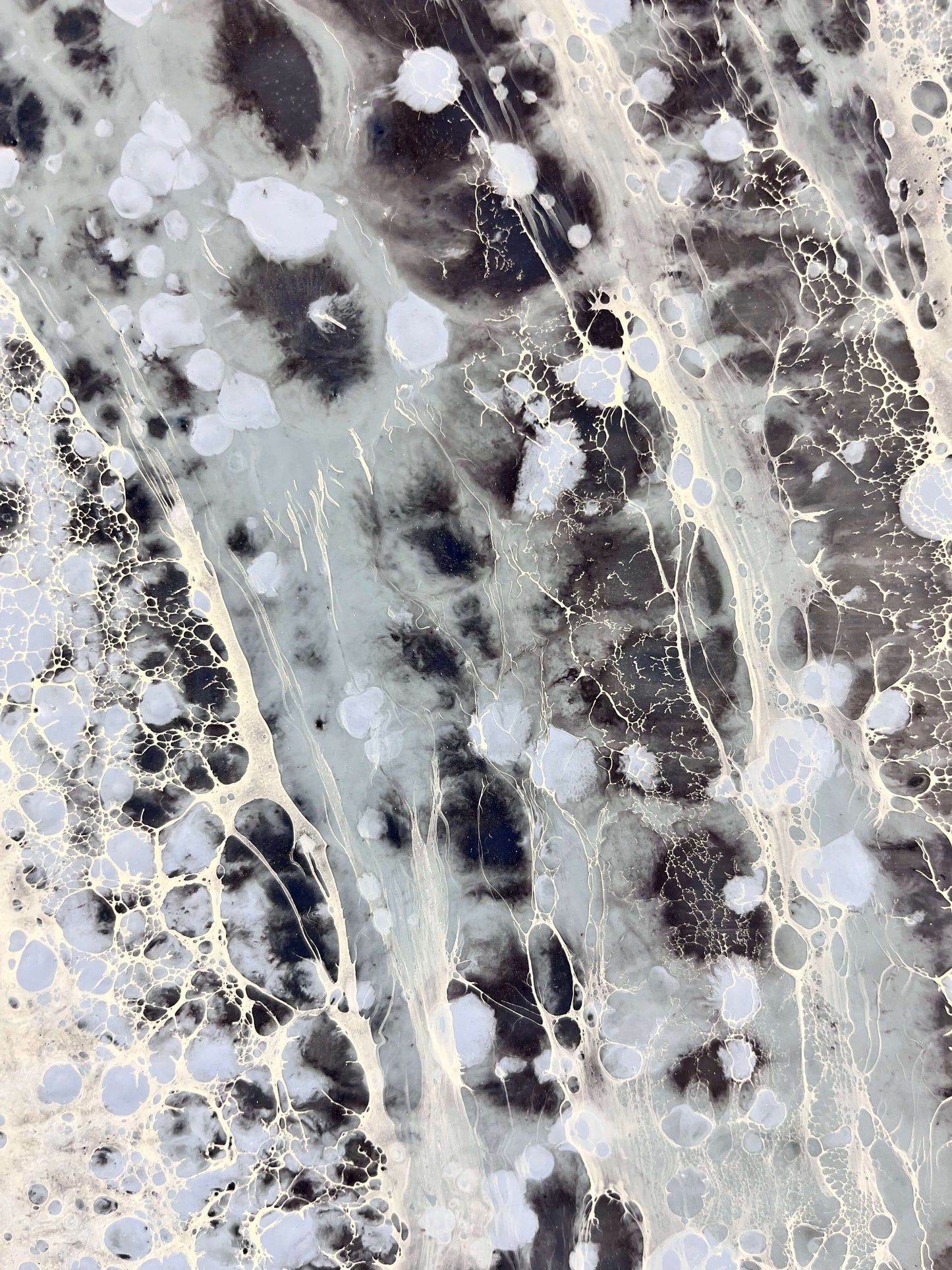 Close-up of a marble-like surface with gray, black, and white patterns