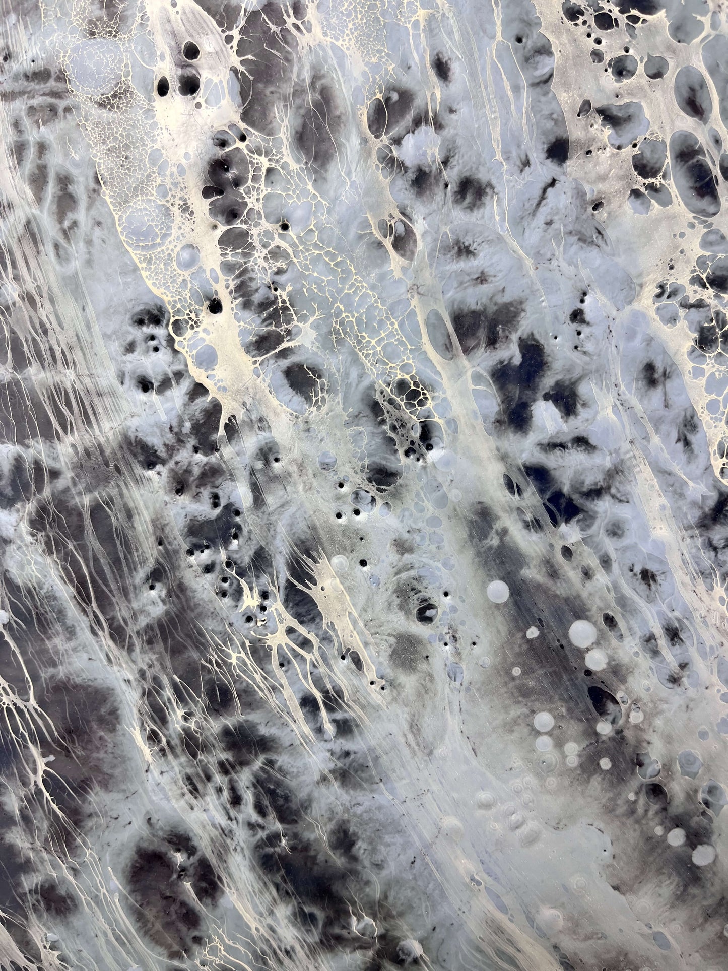 Close-up of a textured surface with fibers and bubbles