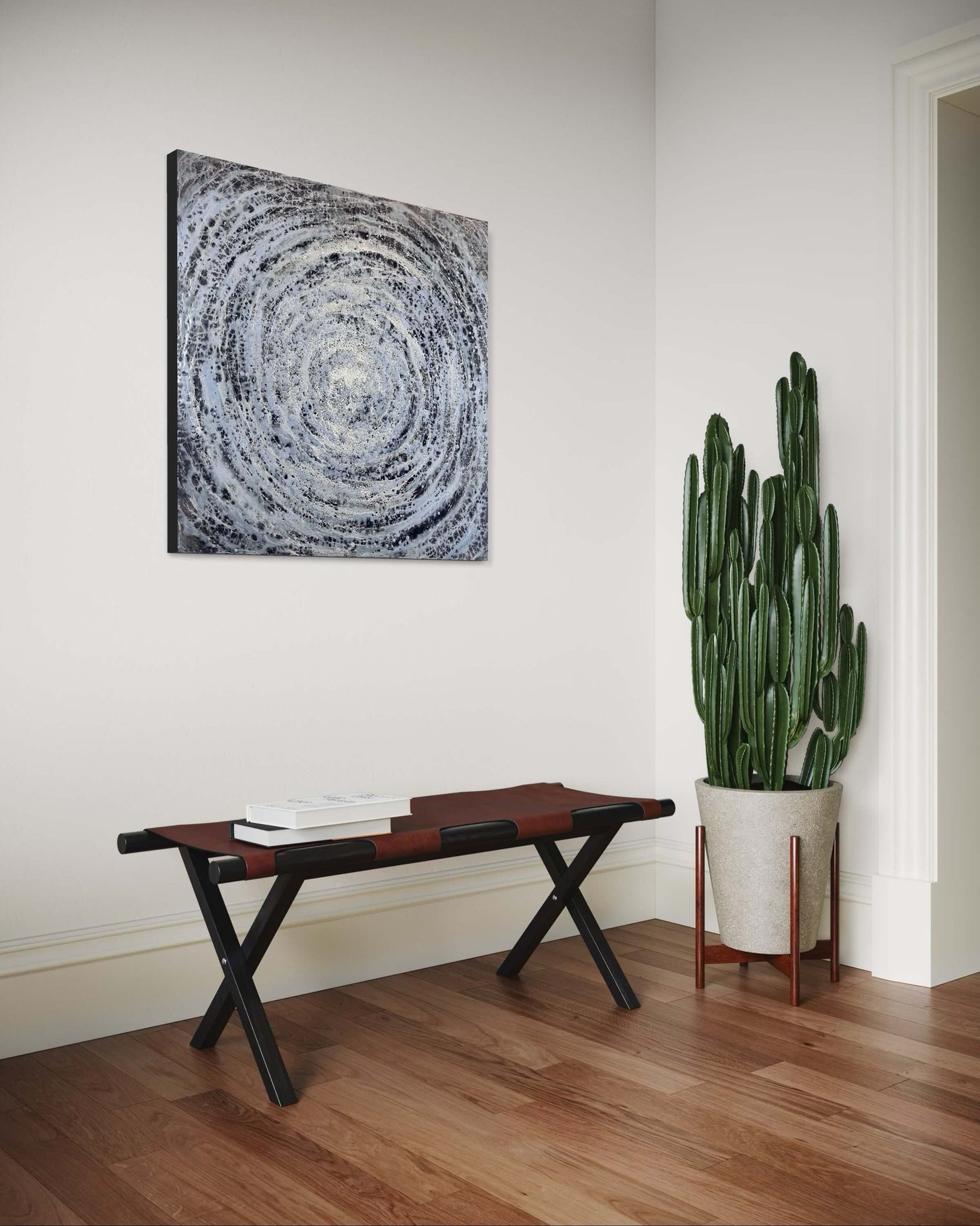 Room interior with abstract painting, bench, and potted cactus on wooden floor.