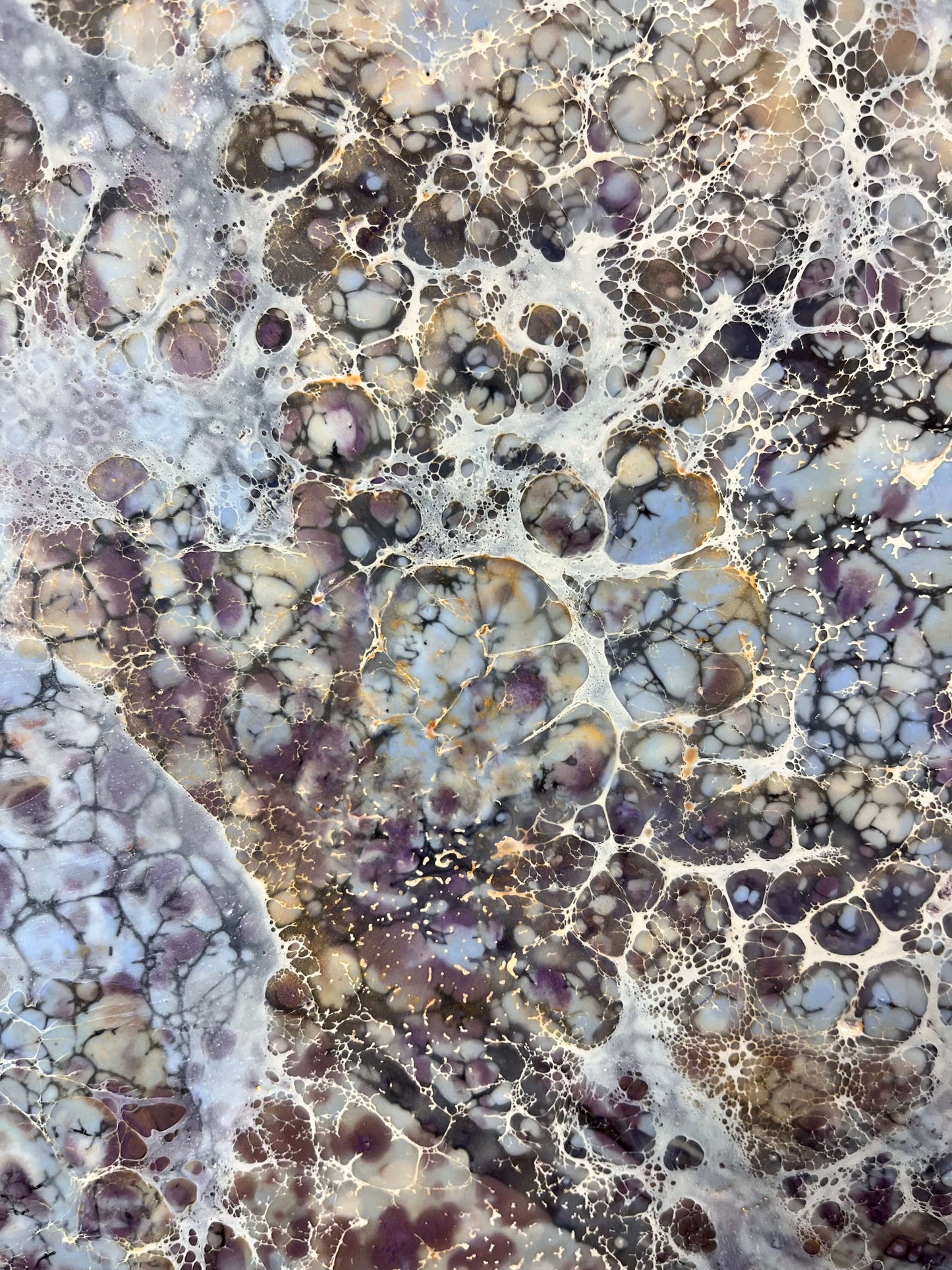 Close up.This abstract painting is created with encaustic medium. The piece is named Moonlight Moth, and the painting is done in warm grey, brown, burgundy and gold shades. It resembles the wings of a moth.