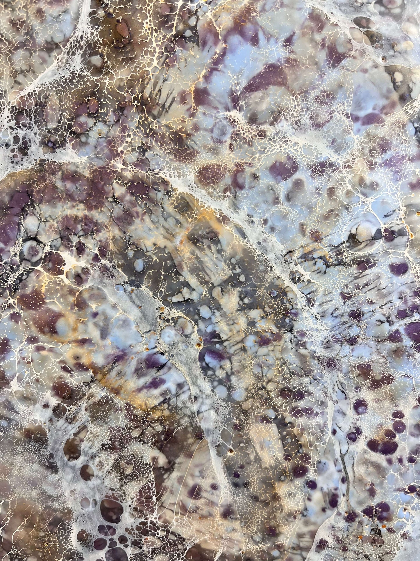 Close up.This abstract painting is created with encaustic medium. The piece is named Moonlight Moth, and the painting is done in warm grey, brown, burgundy and gold shades. It resembles the wings of a moth.