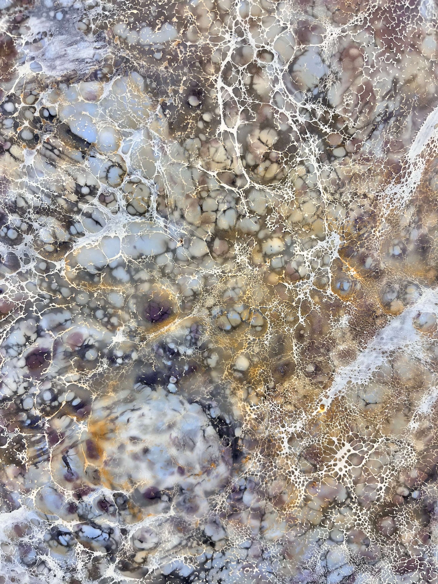 Close up.This abstract painting is created with encaustic medium. The piece is named Moonlight Moth, and the painting is done in warm grey, brown, burgundy and gold shades. It resembles the wings of a moth.