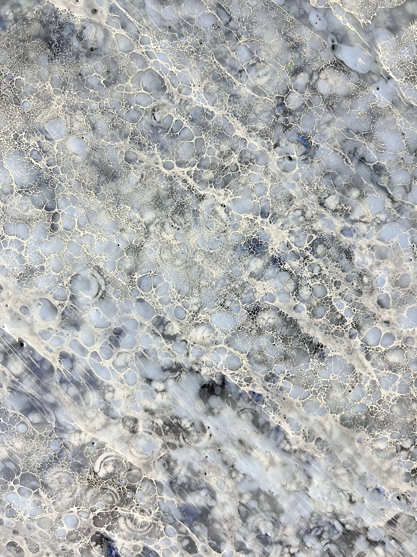 Close up.This abstract painting is done in monochromatic tones of black, grey, blue and white. It has a lot of close up juicy details. Strong directional lines make your eye go deep into the heart of a painting. This piece is 36"x36"