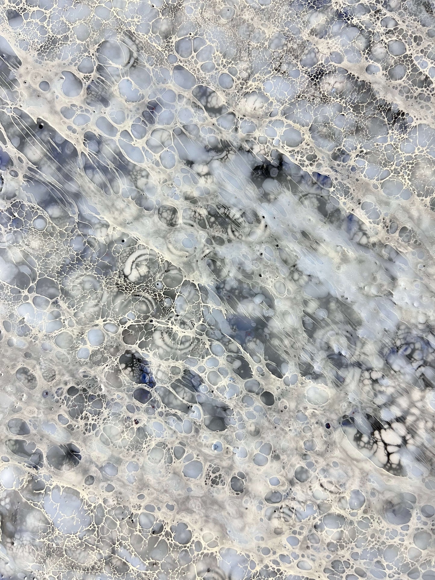 Close up.This abstract painting is done in monochromatic tones of black, grey, blue and white. It has a lot of close up juicy details. Strong directional lines make your eye go deep into the heart of a painting. This piece is 36"x36"