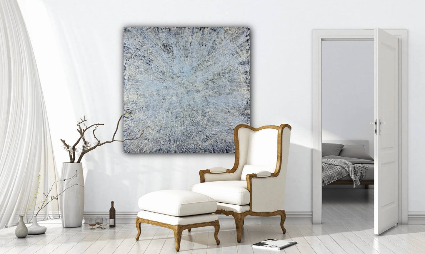 Original abstract encaustic painting is done in monochromatic tones of blues and white with layered directional textures displayed above an armchair in a french modern nterior