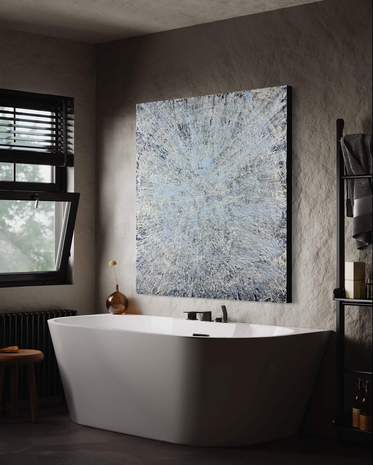 Original abstract encaustic painting is done in monochromatic tones of blues and white with layered directional textures displayed on a plaster wall above a porcelain bathtub in a modern bathroom interior