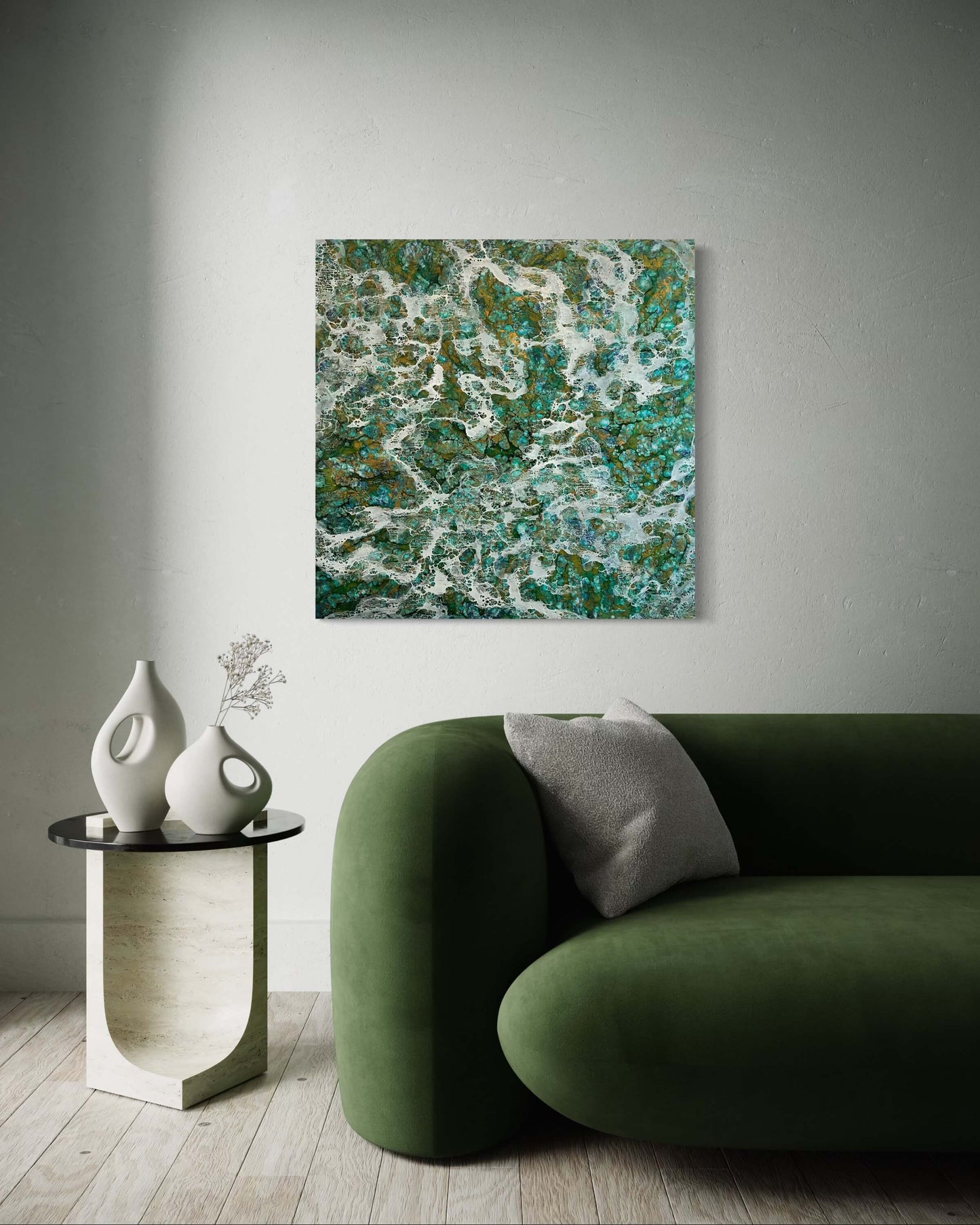 Original abstract encaustic painting with flowing white patterns over a rich mix of turquoise, emerald, and earthy tones, resembling ocean foam or mineral formation displayed above a couch in a modern interior