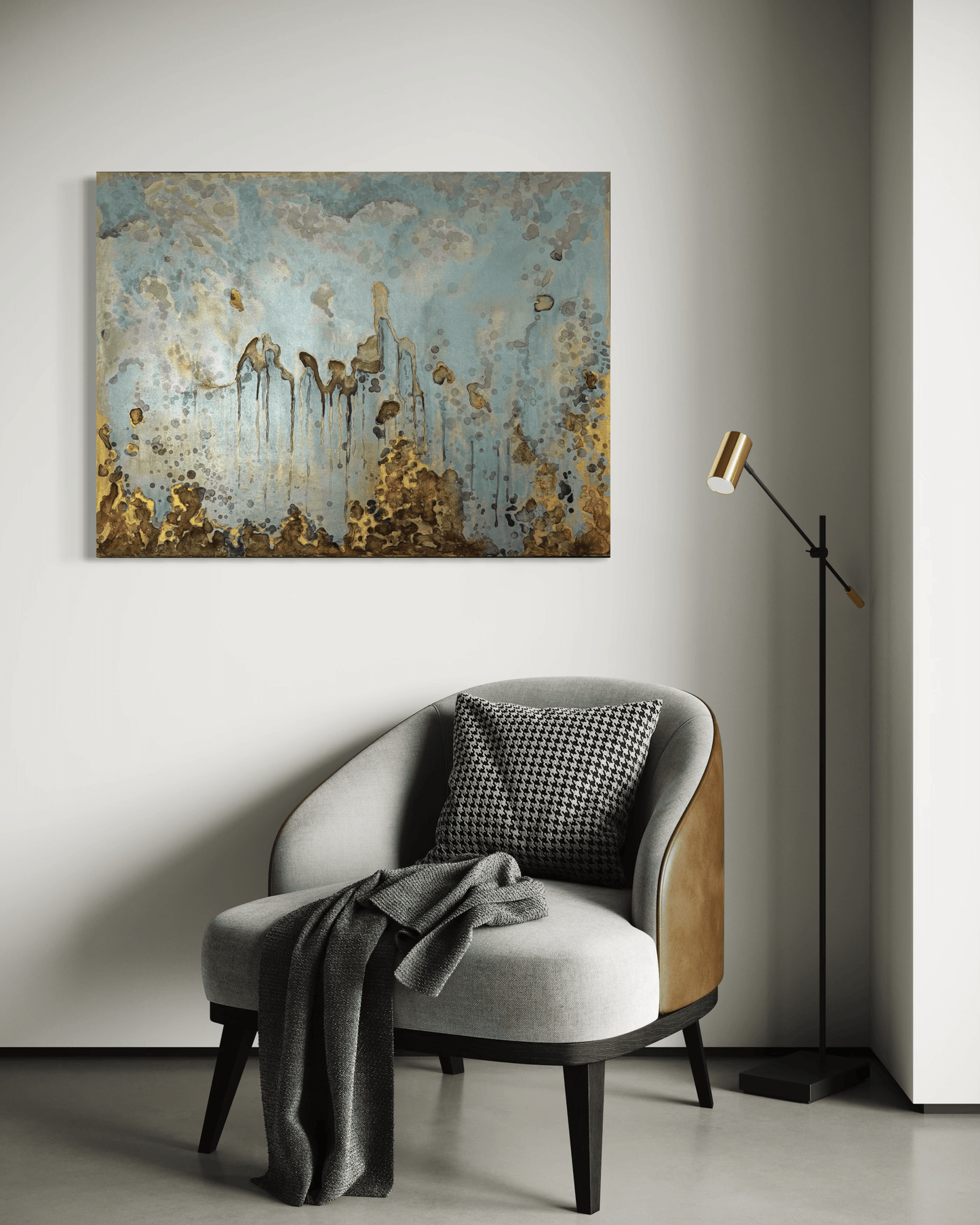 Original abstract painting in blue , gold and silvered with layered brown and rust textures and organic forms displayed above an armchair and floor lamp in modern interior.