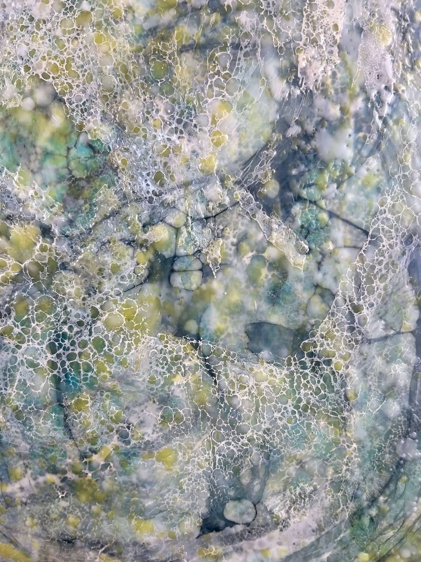 close up.16x20in. This abstract painting was named and inspired by a song written by Damien Jurado, Working Titles. This piece of music, even though the overall sound is melodic and very calming, the lyrics, however are about heartbreak. The overall feel of this painting is quite serene with its blues, greens and yellows. The colours are reminiscent of evergreens of Seattle WA shrouded in dense fog. The delicate lace like texture created by shellac has an interesting flowing pattern.