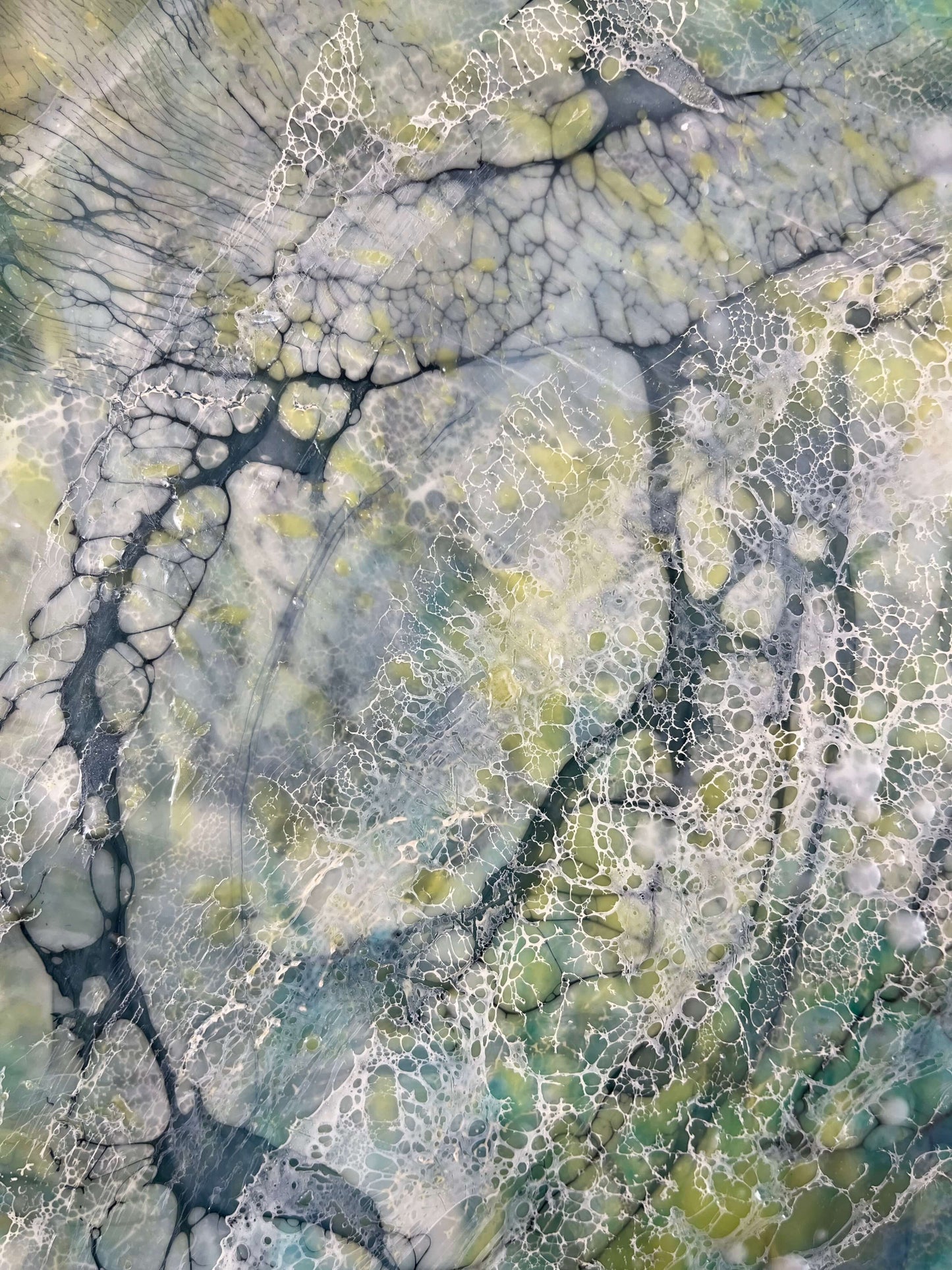 close up.16x20in. This abstract painting was named and inspired by a song written by Damien Jurado, Working Titles. This piece of music, even though the overall sound is melodic and very calming, the lyrics, however are about heartbreak. The overall feel of this painting is quite serene with its blues, greens and yellows. The colours are reminiscent of evergreens of Seattle WA shrouded in dense fog. The delicate lace like texture created by shellac has an interesting flowing pattern.