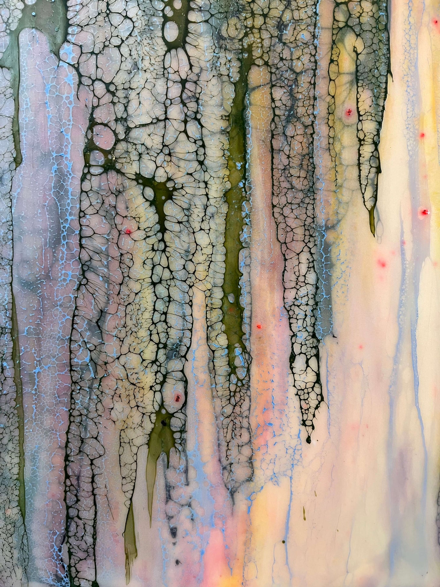 Close up.Abstract Encaustic Painting, 16x20in. Created with beeswax, damar resin, dry pigments and shellac on cradled wood panel. This painting is playful, but delicate with a gentle energy. The colours of this piece are soft pinks, periwinkle blues, majestic purples and moody greens. The delicate lace-like texture draping over the painting has this protective and enveloping effect as if the colours underneath it, while blending with each other, are shy and private. Hanging hardware is included