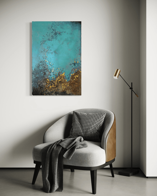 Original  abstract painting in blue, gold, brown and rust tones with layered textures and organic forms displayed above an armchair and floor lamp in modern interior