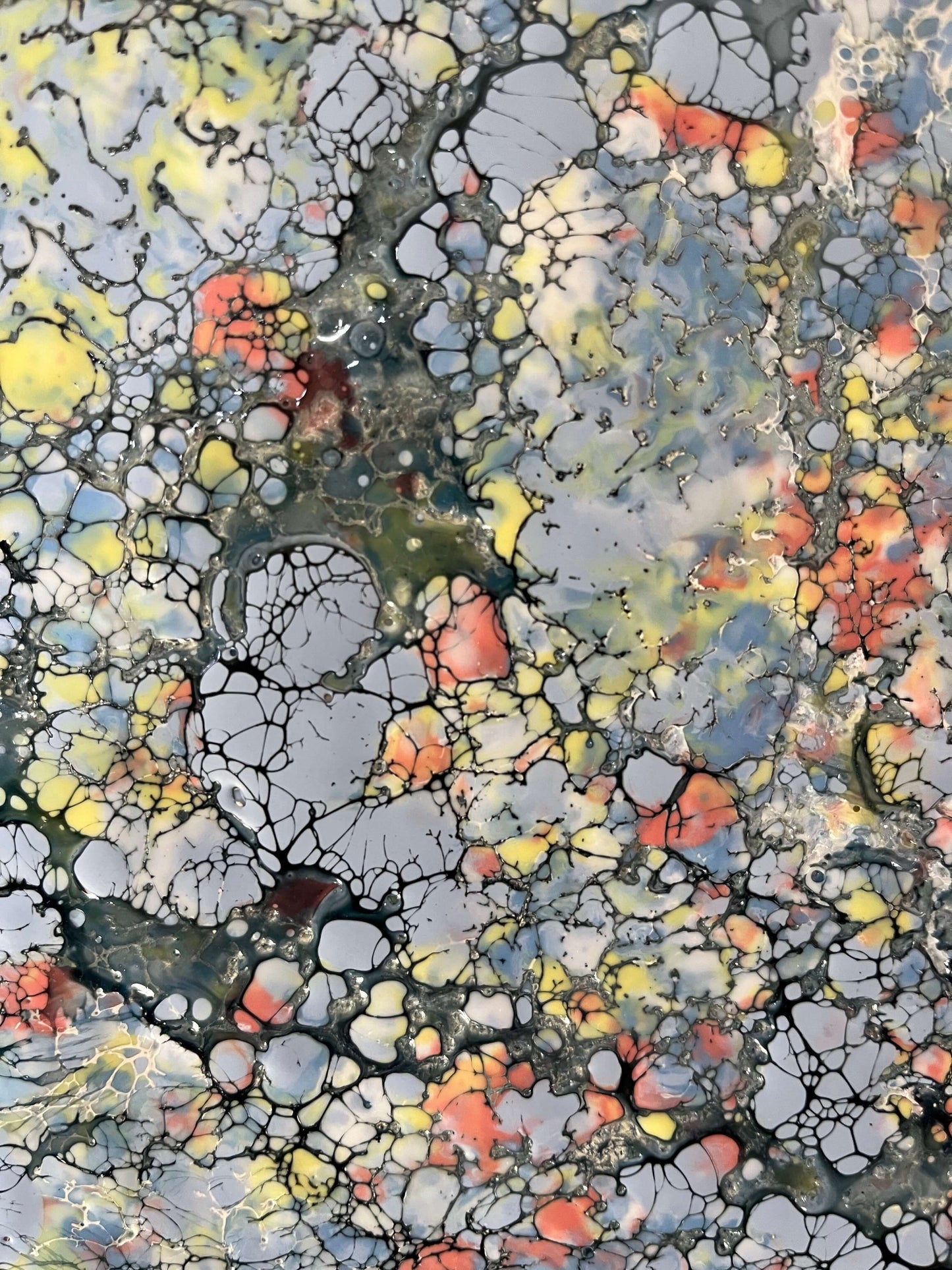 Close up.This piece has a very uplifting energy with its variations of blues, greys and specks of yellow and orange. it is a textured painting, when you run your fingers over it, you will feel ripples of wax. The droplets of orange wax signifies Monarch butterflies taking to the sky.