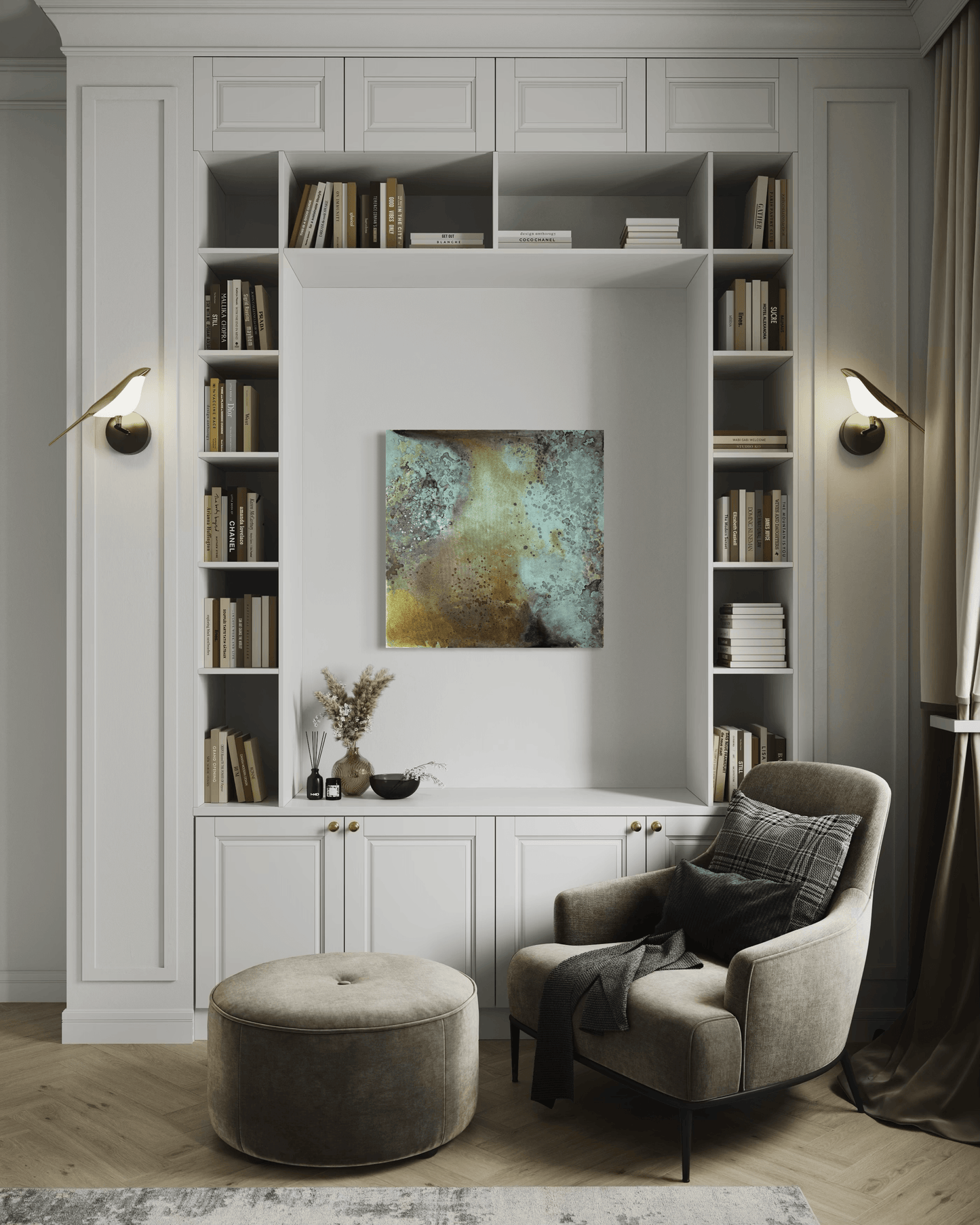 Original abstract painting in blue, grey, brown and gold tones with layered textures and organic forms displayed in a recessed alcove in a built in bookcase behind an armchair in a modern interior.