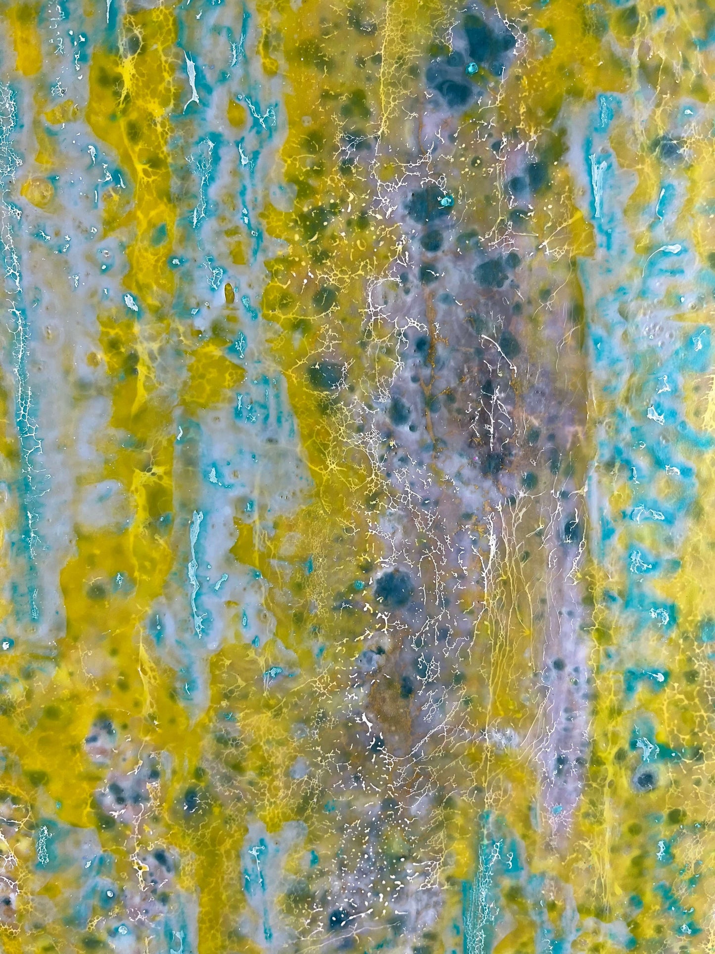 Close up.This painting is reminiscent to me of a wall of an old building that has been weathered with humidity and sun. The greens and yellows are like moss that has developed on the plaster where blue paint has cracked and been peeling.