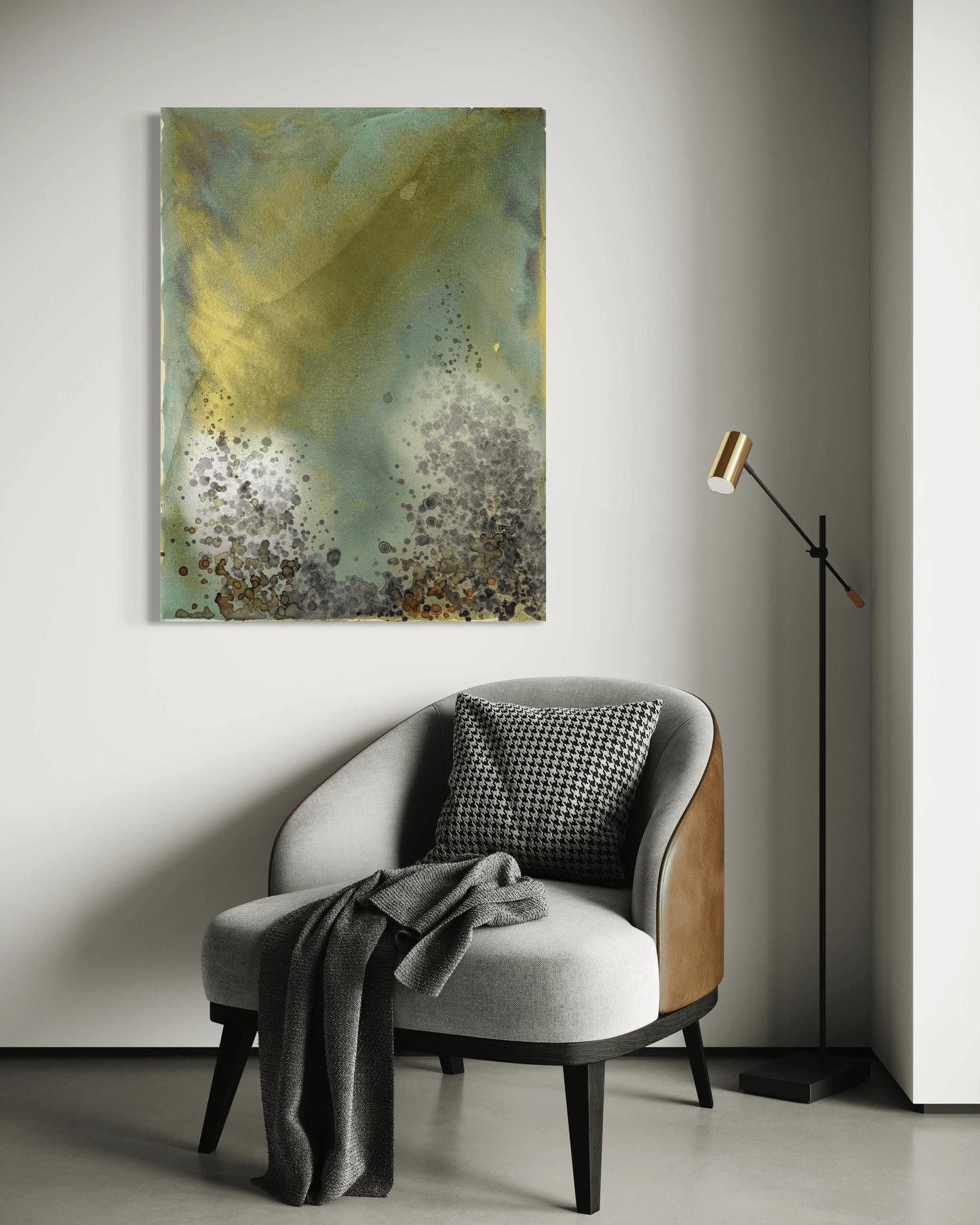 Original abstract painting in yellow, green, blue, gold with layered wine stain textures and organic forms displayed above an armchair and floor lamp in modern interior