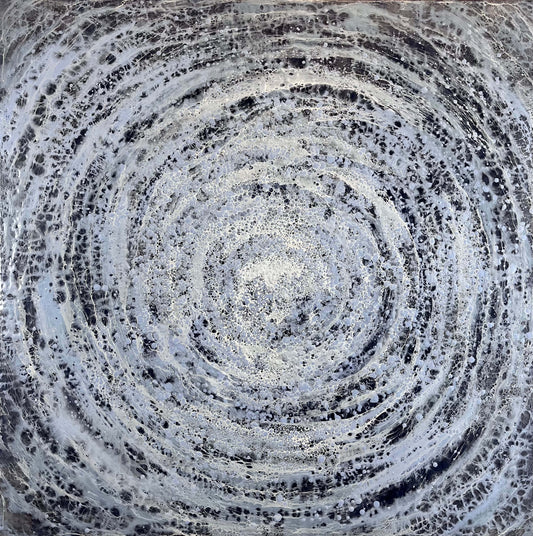 Abstract circular pattern with concentric circles in black, white and blue