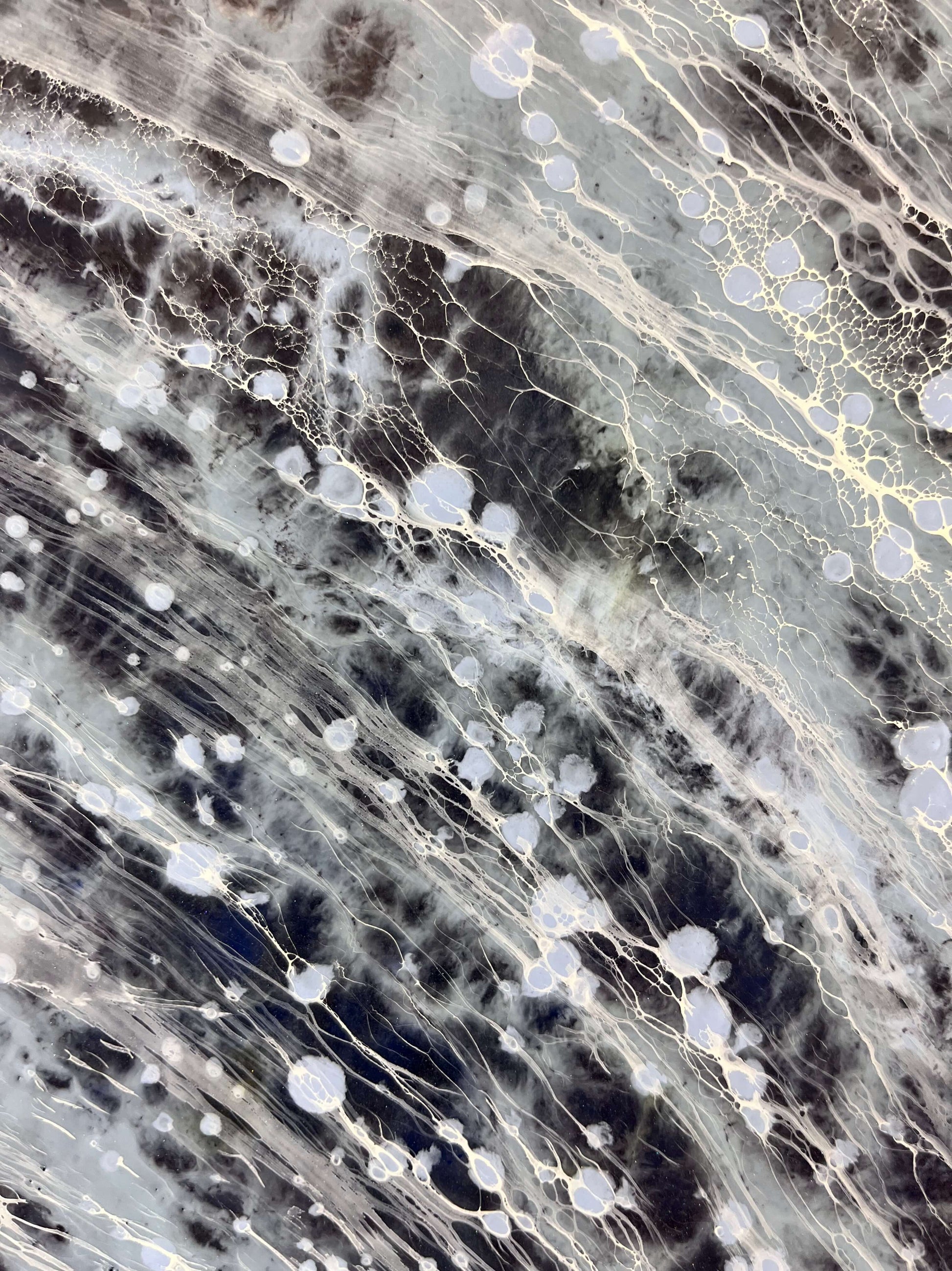 Close-up of a marble-like surface with gray, black, and white patterns