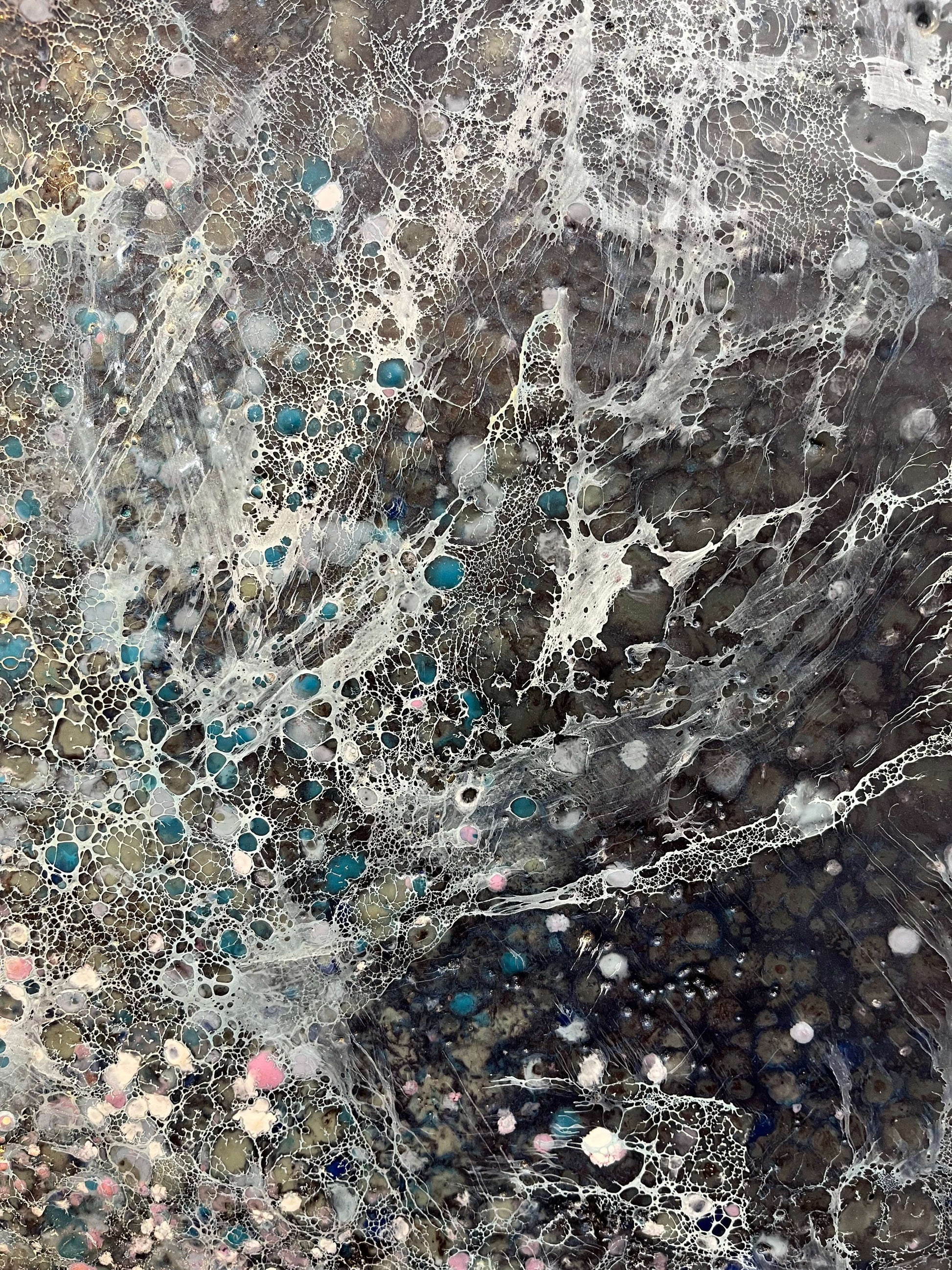 Close up.This painting has a vibrational feeling,  it resembles the glow, movement and flickering of stars and the vastness of our universe. With moody colours of black, grey, white, blues, pink and accents of gold.