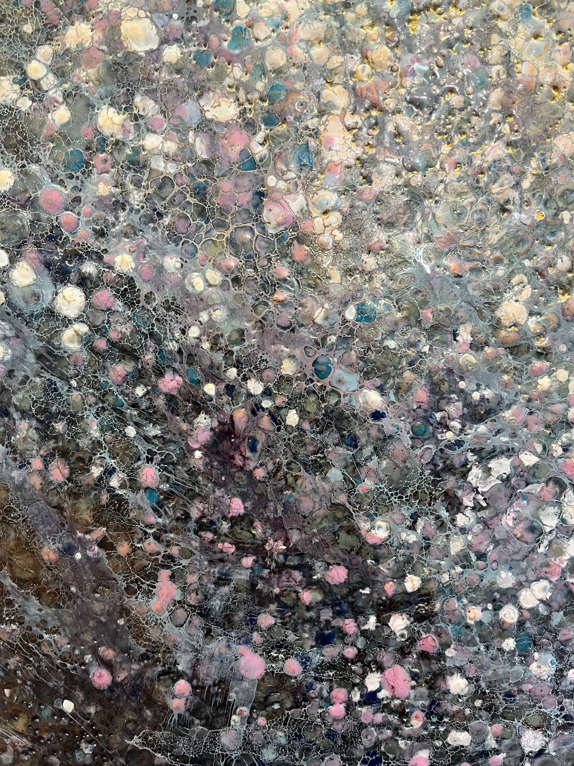 Close up.This painting has a vibrational feeling,  it resembles the glow, movement and flickering of stars and the vastness of our universe. With moody colours of black, grey, white, blues, pink and accents of gold.