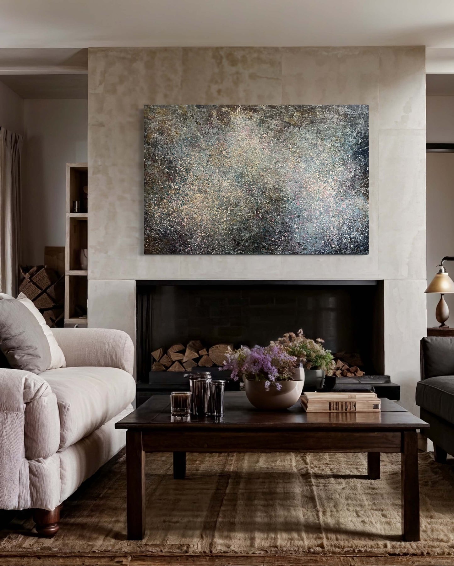 In situ.This painting has a vibrational feeling,  it resembles the glow, movement and flickering of stars and the vastness of our universe. With moody colours of black, grey, white, blues, pink and accents of gold.